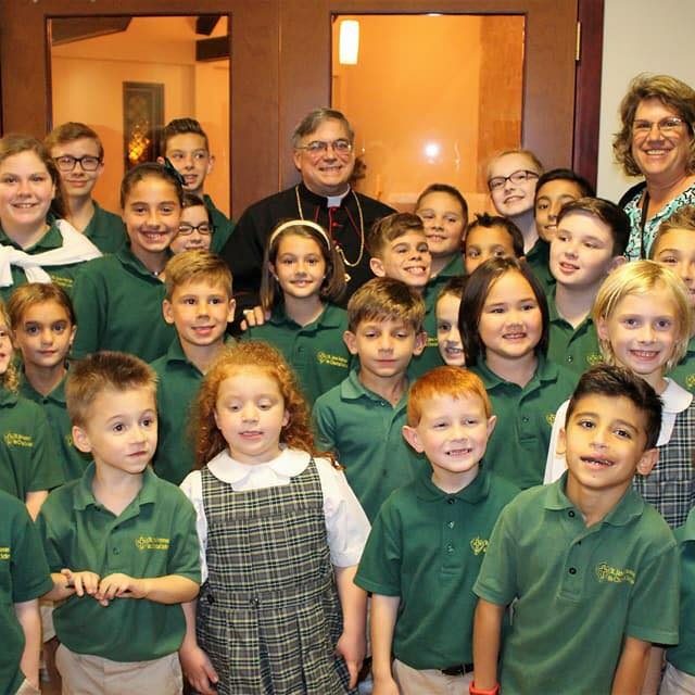School Students with Bishop Schlert square ec9664403aea397f5b6521f3ef8d0b6c 59f7e0b1cca9a
